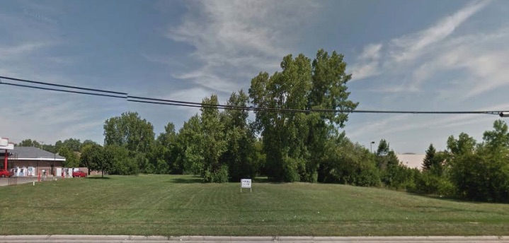 2939 Shiloh Springs Road. An empty lot with grass and trees